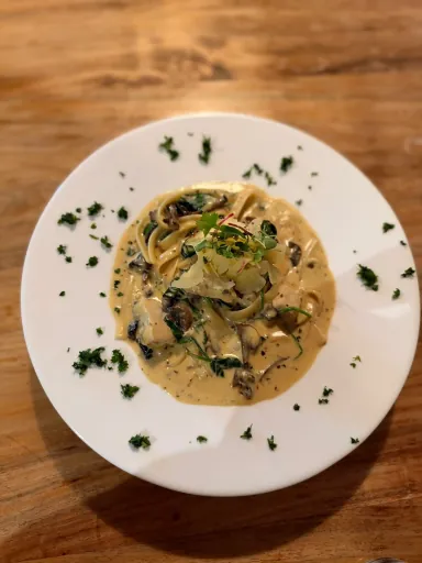 Fettuccine topped with fresh herbs