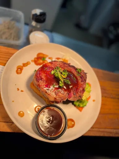 A plated meal with vegetables and sauce from the Lakefront kitchen